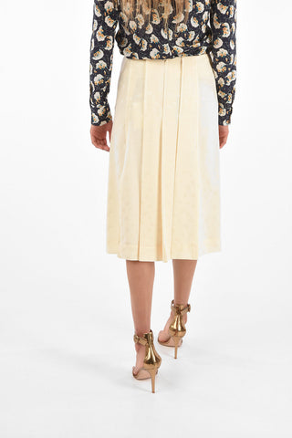 silk split-back hem and double split-front hem skirt with golden buttons