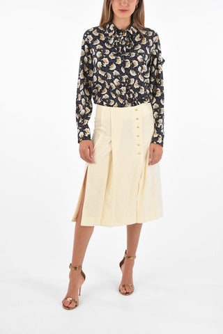 silk split-back hem and double split-front hem skirt with golden buttons