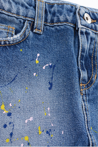 gonna in denim con schizzi di vernice