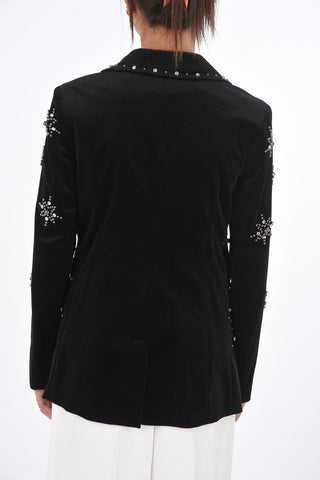 blazer in velluto con borchie e gioielli