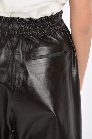 Shiny Leather Pants with Waistband and Ankle Velcro Detail