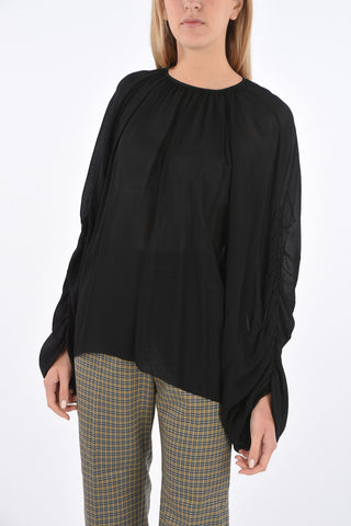 Blusa con manica drappeggiata