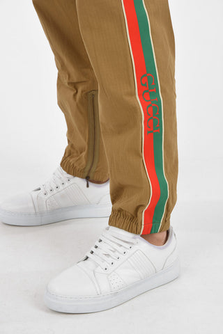 logoed side band pants with ankle zip