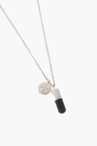 Silver necklace with pill pendant
