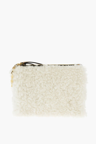 shearling clutch with logoed charm