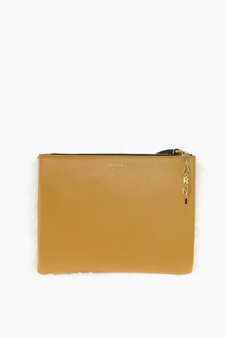 shearling clutch with logoed charm