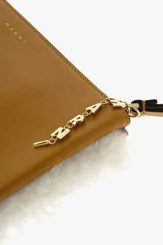 shearling clutch with logoed charm
