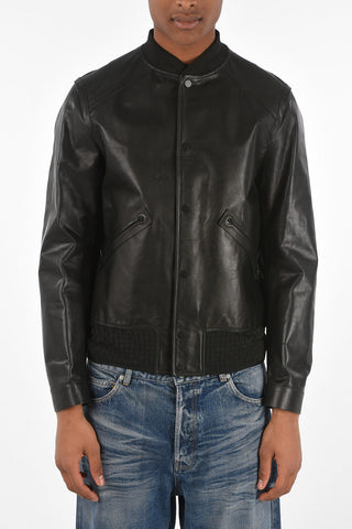 bomber in pelle con bottoni automatici