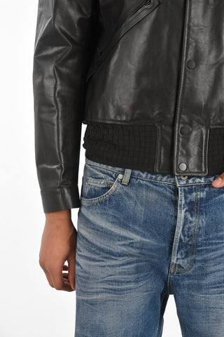 bomber in pelle con bottoni automatici