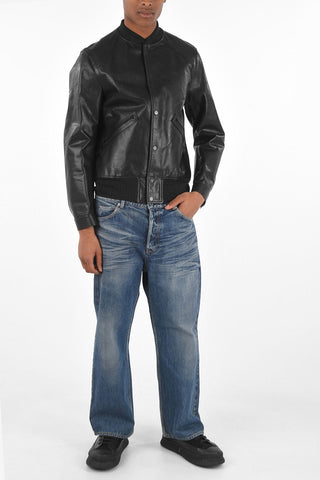 bomber in pelle con bottoni automatici