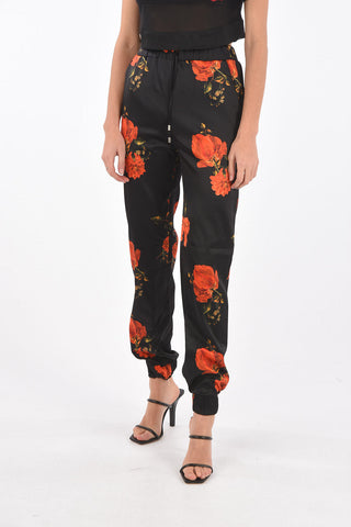 COUTURE pantalone jogger in seta con stampa rose