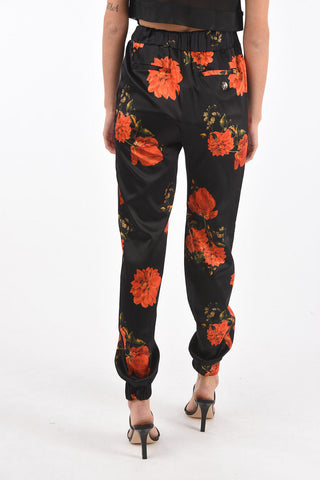 COUTURE pantalone jogger in seta con stampa rose