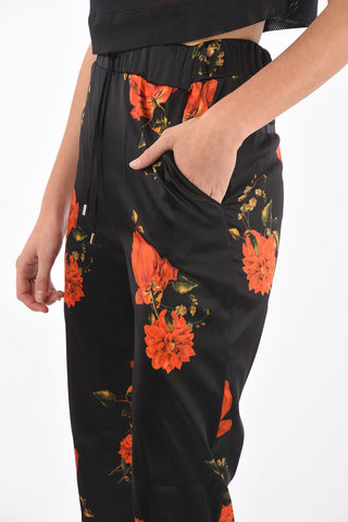 COUTURE pantalone jogger in seta con stampa rose