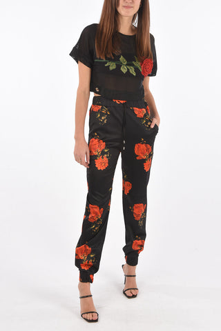 COUTURE pantalone jogger in seta con stampa rose