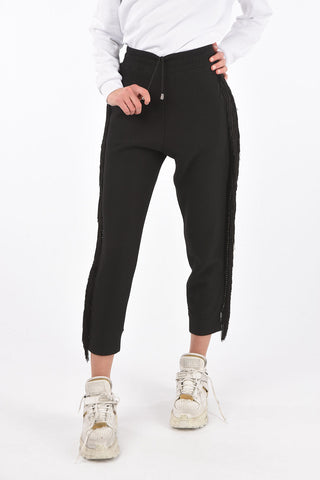 COUTURE Pantaloni gogger REVENGE con frange e borchie