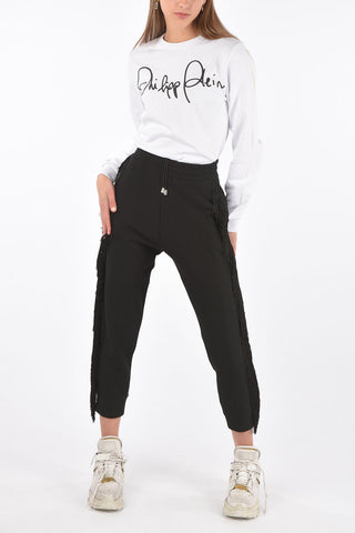 COUTURE Pantaloni gogger REVENGE con frange e borchie