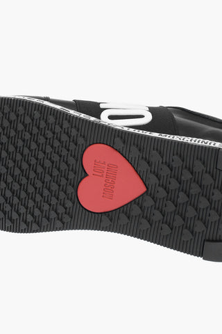 LOVE leather RUN40 slip on sneakers with all over logo sole