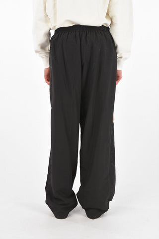 Pantaloni tracksuit oversize con elastico in vita