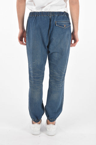 Mid wash jeans with drawstrings and cuffed ankles
