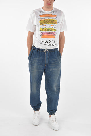 Mid wash jeans with drawstrings and cuffed ankles