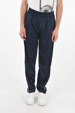 Embroidered track pants with elastic waist