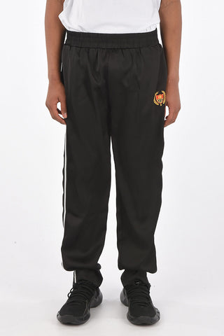 Pantaloni piping con coulisse in vita