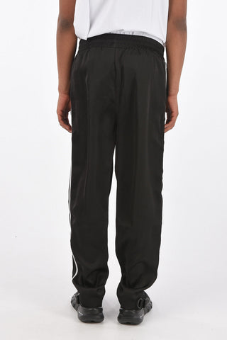 Pantaloni piping con coulisse in vita