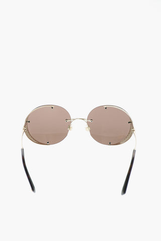 round sunglasses with perforated details