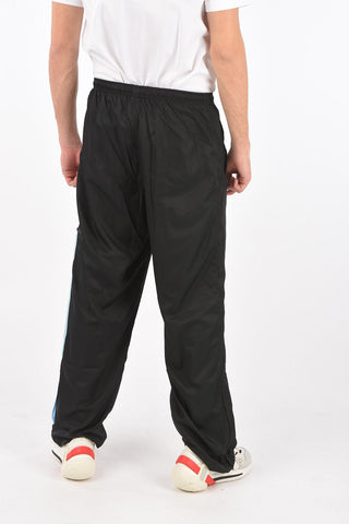 pantaloni track con zip alla caviglia
