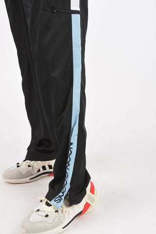 pantaloni track con zip alla caviglia