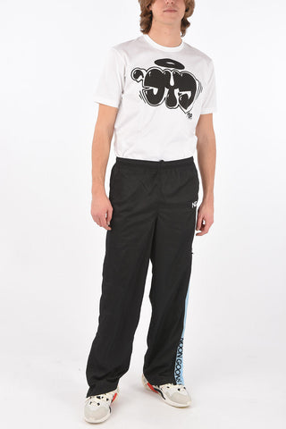 pantaloni track con zip alla caviglia