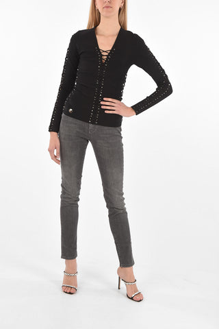 COUTURE EST.1978 top manica lunga lace up con borchie
