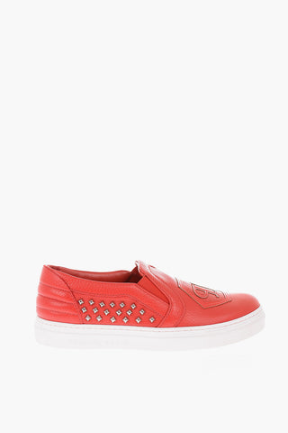 leather slip on sneakers with side studs
