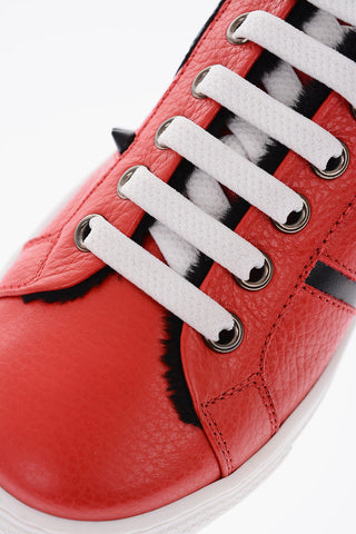 leather sneakers with side studs and faux fur inner