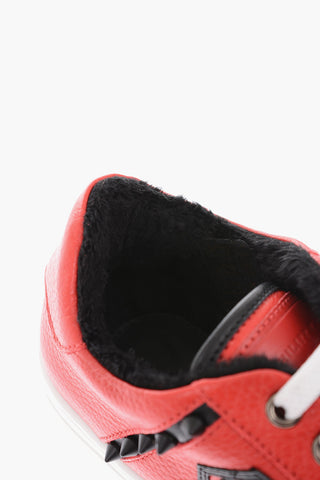 leather sneakers with side studs and faux fur inner