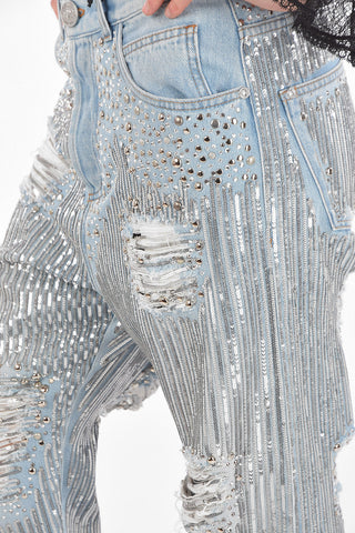jeans distressed in paillettes con borchie