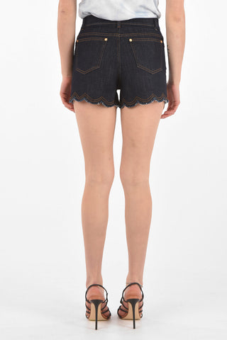 shorts in denim stretch con orlo sfrangiato