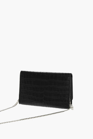 crocodile effect leather clutch decorated with claw rings