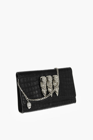 crocodile effect leather clutch decorated with claw rings