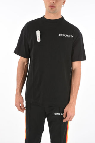 solid color crew-neck t-shirt with brooch 