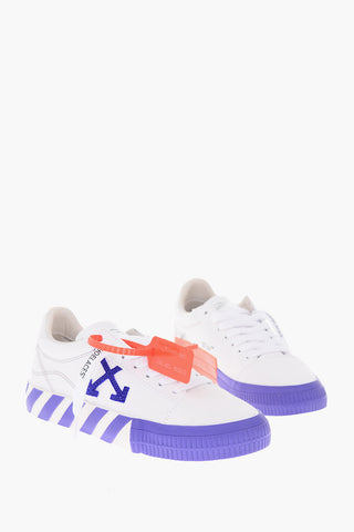 Two-tone canvas and leather VULCANIZED low top sneakers with lettering details