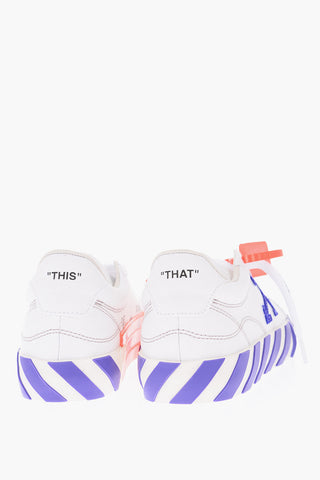 Two-tone canvas and leather VULCANIZED low top sneakers with lettering details