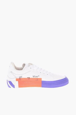 Two-tone canvas and leather VULCANIZED low top sneakers with lettering details