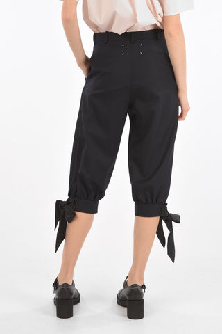 MM0 double-pleat cropped pants with bow hem