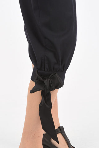 MM0 double-pleat cropped pants with bow hem
