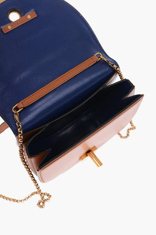 golden detail leather saddle bag