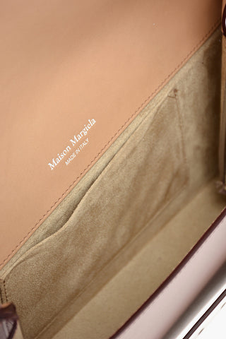 MM11 leather SNATCHED clutch with removable shoulder strap