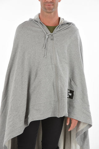 asymmetrical cape with hood and zip closure