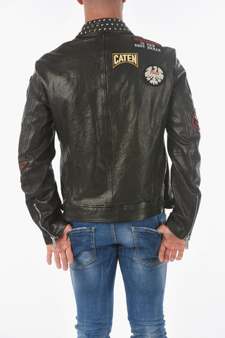 leather jacket with patches and studs on the collar