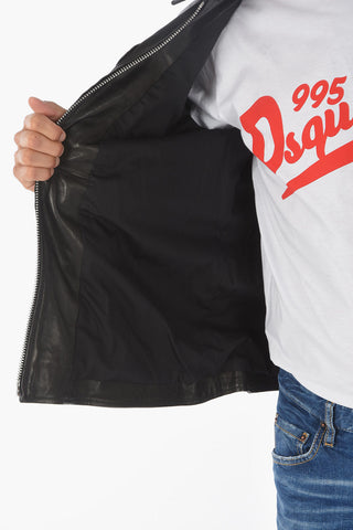leather jacket with patches and studs on the collar
